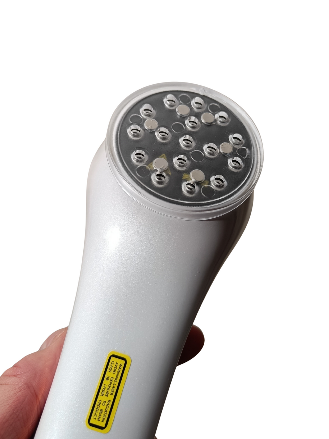 Laserhoitolaitteen magneettinen suojakansi lähikuvassa